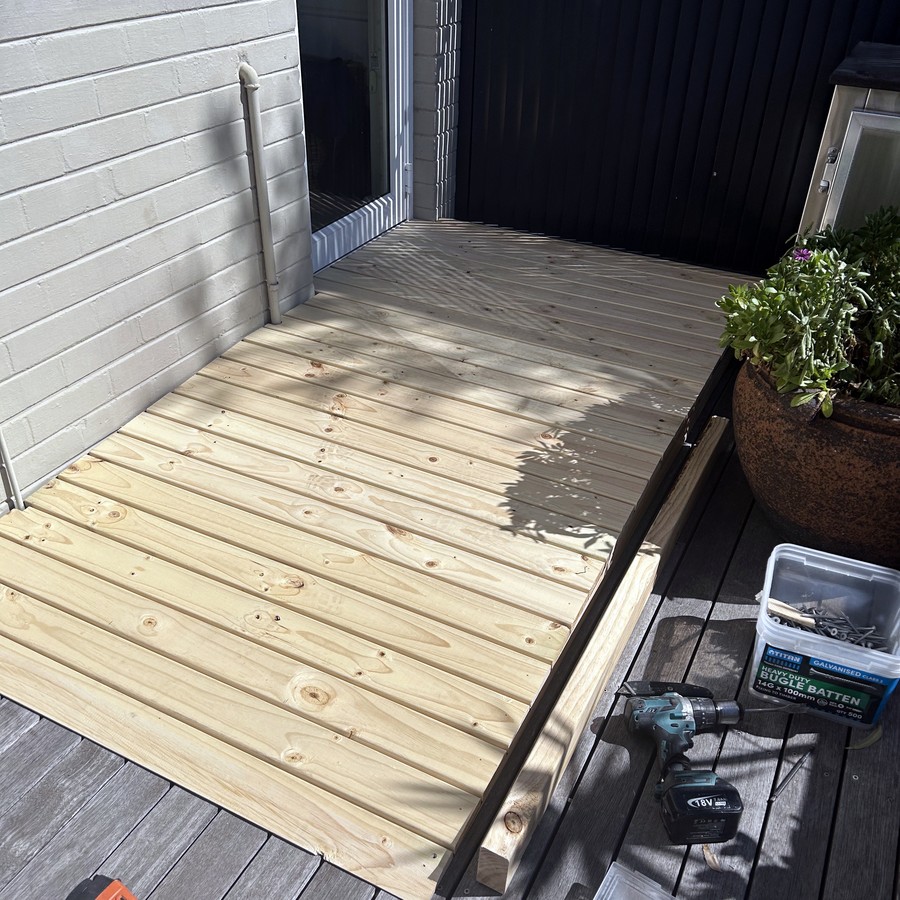 Timber deck landing with a step for safe access