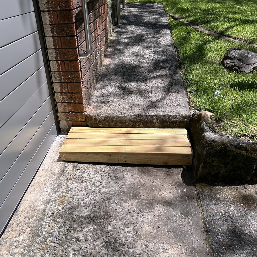 Small timber threshold ramp over a step