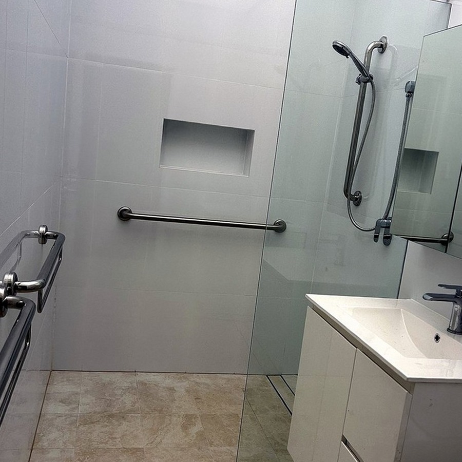 Accessible bathroom with a walk-in shower and grab rails, Sydney