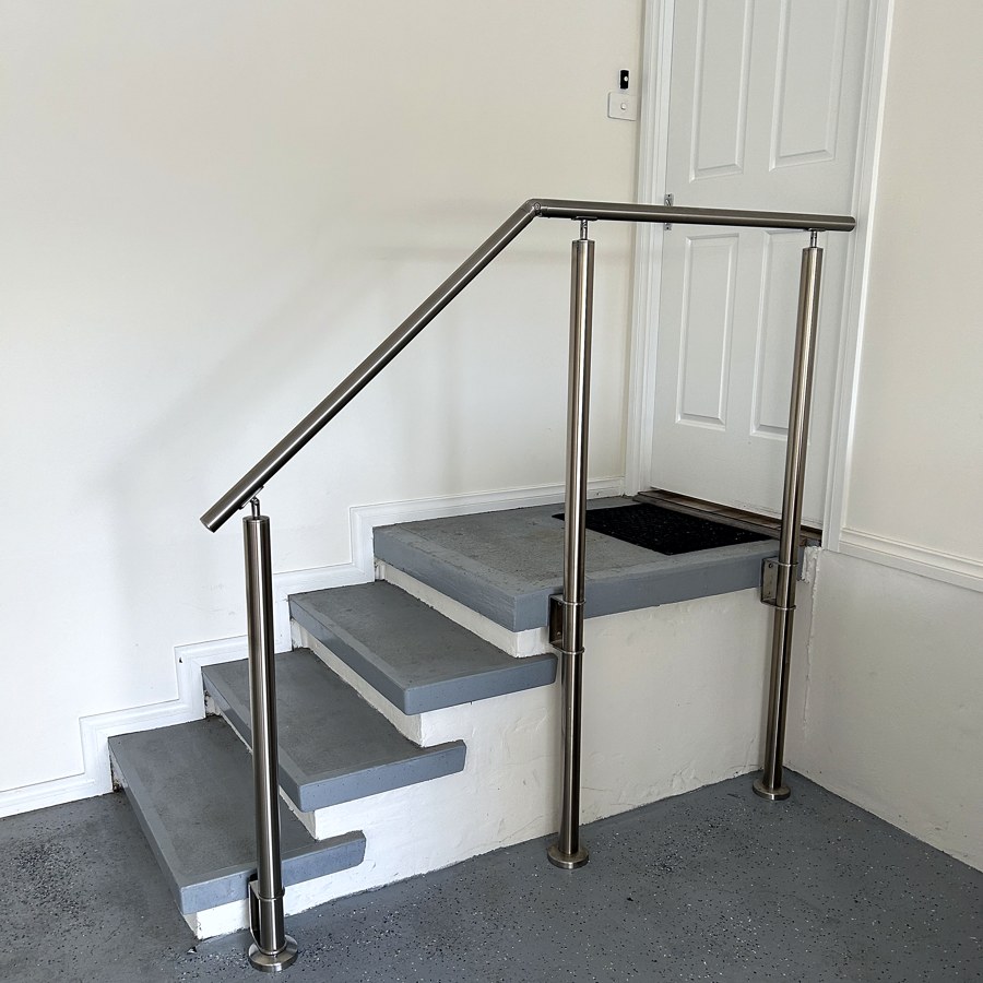 Modern stainless steel balustrade and handrail at a home entrance