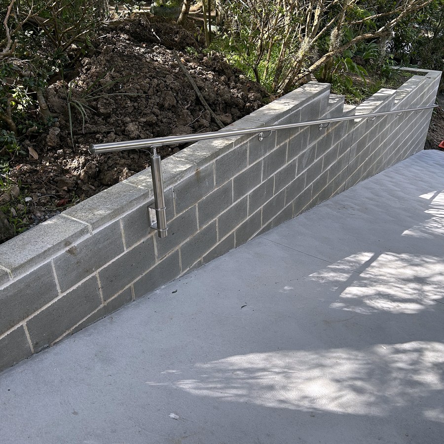 Stainless steel handrail installed on a concrete access ramp in Sydney
